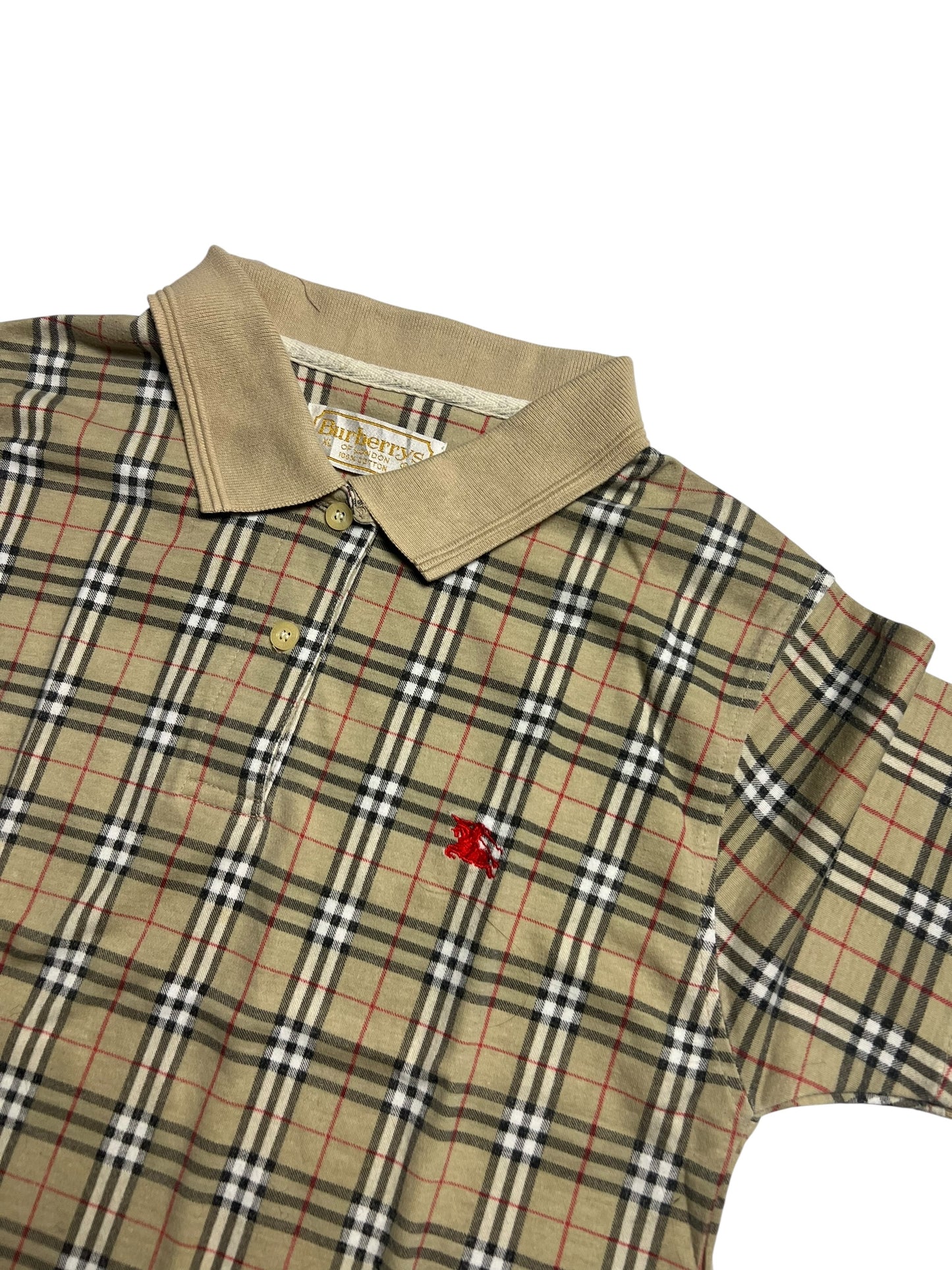 Beige kariertes Burberry Polohemd (XS) von ZAZA resell mit hellbraunem Kragen, Knöpfen, kleinem roten gestickten Emblem auf der linken Brust. Das Plaid ist schwarz, weiß und rot gestreift. Maße auf Anfrage, Zustand 9.